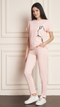 Women's Pink Lycra blend tracksuit with a black cat print on the t-shirt.
• A woman modeling a comfortable grey tracksuit with an animal print design, perfect for loungewear or casual outfits.
• Full-length view of a Pink tracksuit featuring a unique cat graphic on the top and matching bottoms.