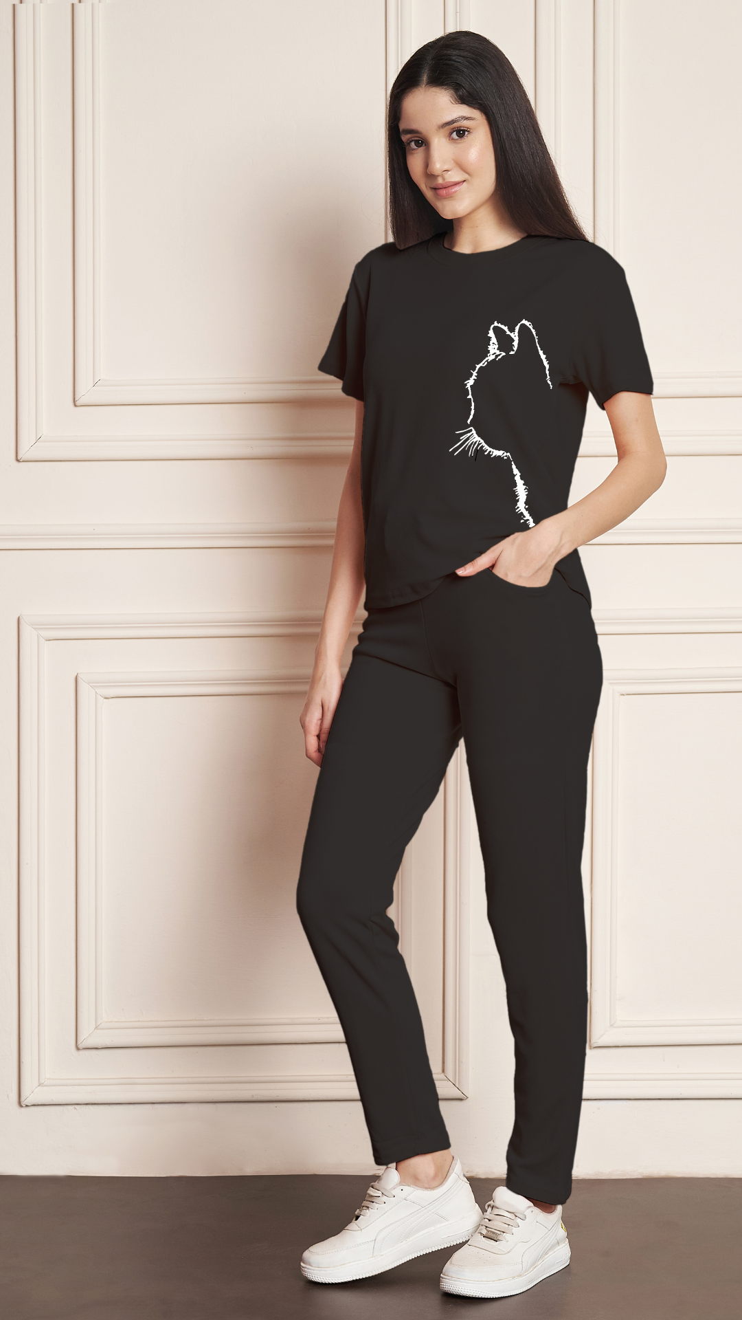 Women's Black Lycra blend tracksuit with a black cat print on the t-shirt.
• A woman modeling a comfortable grey tracksuit with an animal print design, perfect for loungewear or casual outfits.
• Full-length view of a black tracksuit featuring a unique cat graphic on the top and matching bottoms.